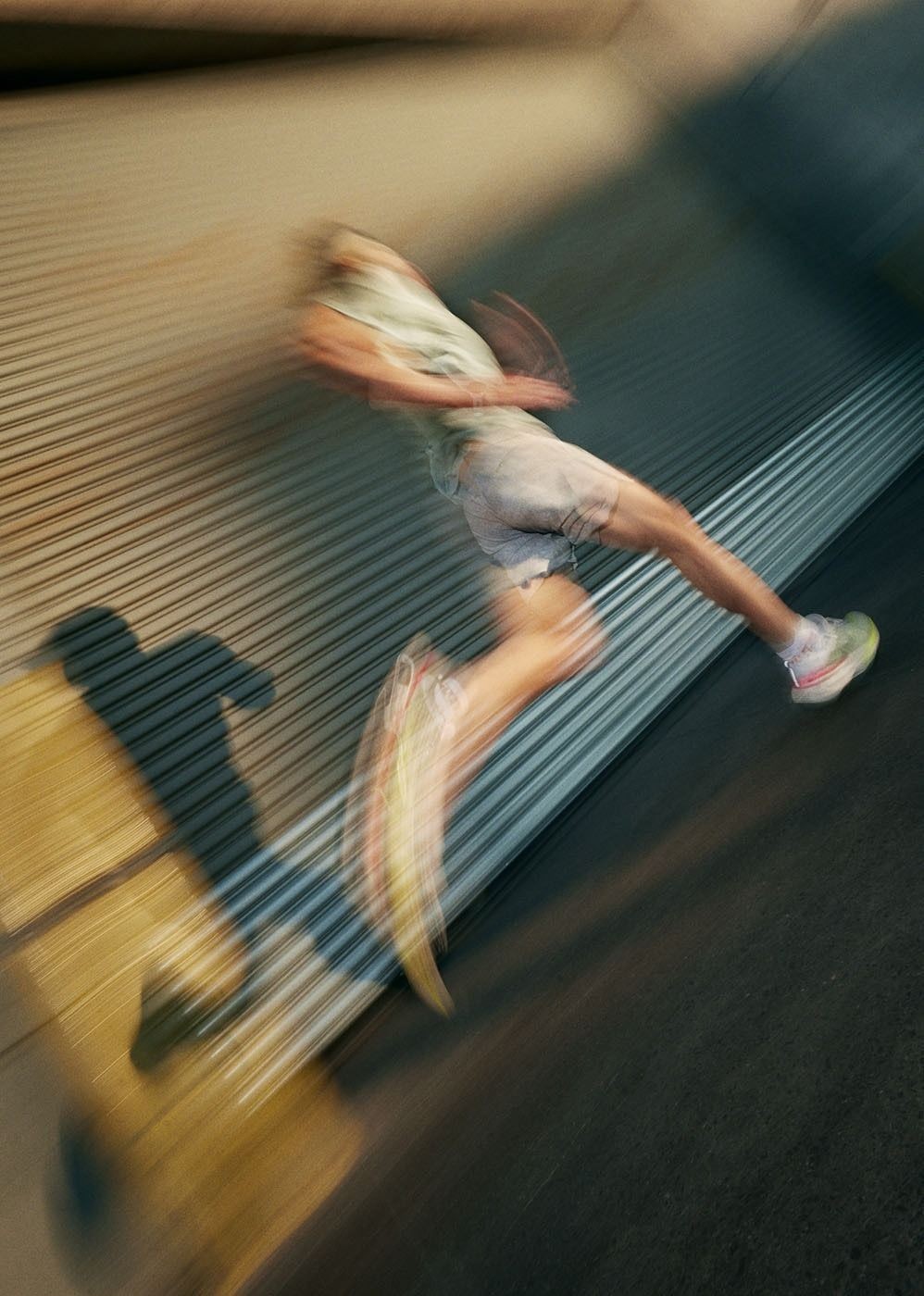 A runner training outdoors on a city street